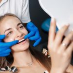 a woman is getting dental treatment