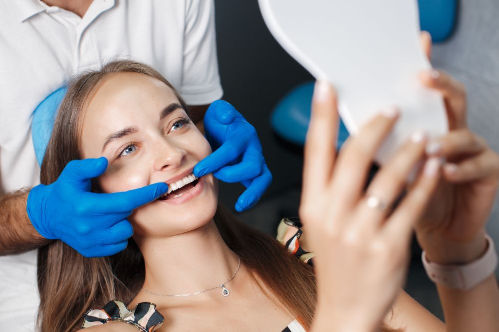 a woman is getting dental treatment
