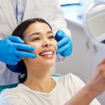 a woman is getting dental treatment