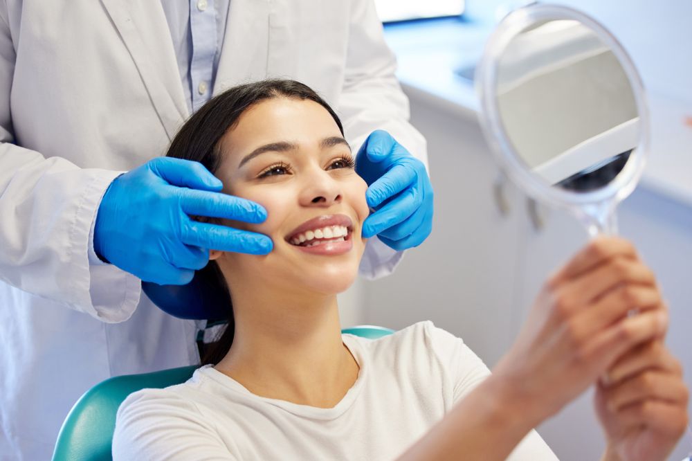 a woman is getting dental treatment