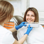 a woman is getting dental treatemnt